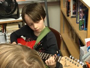 Kid Playing Guitar