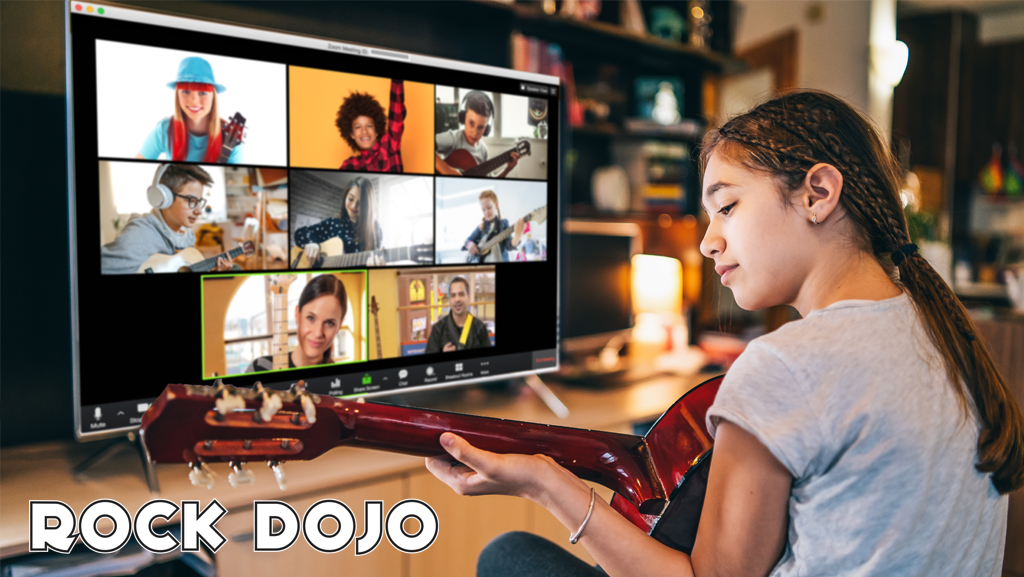 A young girl participates in an online group guitar lesson for Rock Dojo. She is seen on the screen along with other Rock Dojo students from all over the country. The lesson is conducted by a guitar sensei and the children are all holding their guitars and following along with the lesson.