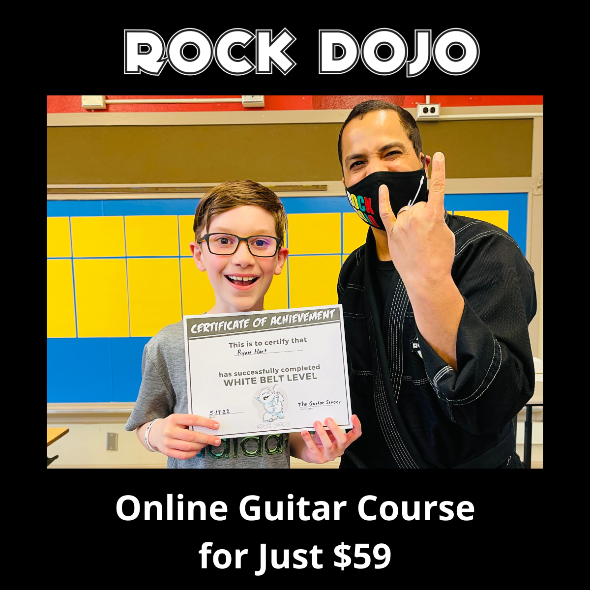 The Guitar Sensei presents a Rock Dojo student with his certificate of completion.