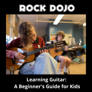 Two pre-teens learning guitar with total focus