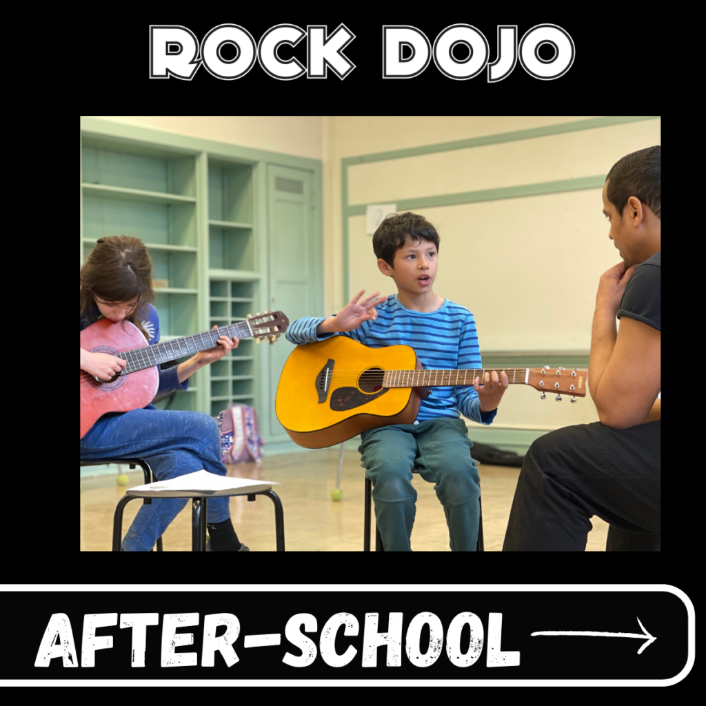 Two focused students during Rock Dojo after-school guitar lesson.