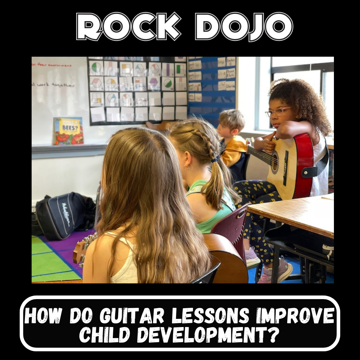 Children enjoying their time in Rock Dojo's after-school guitar lessons, improving their cognitive and social skills