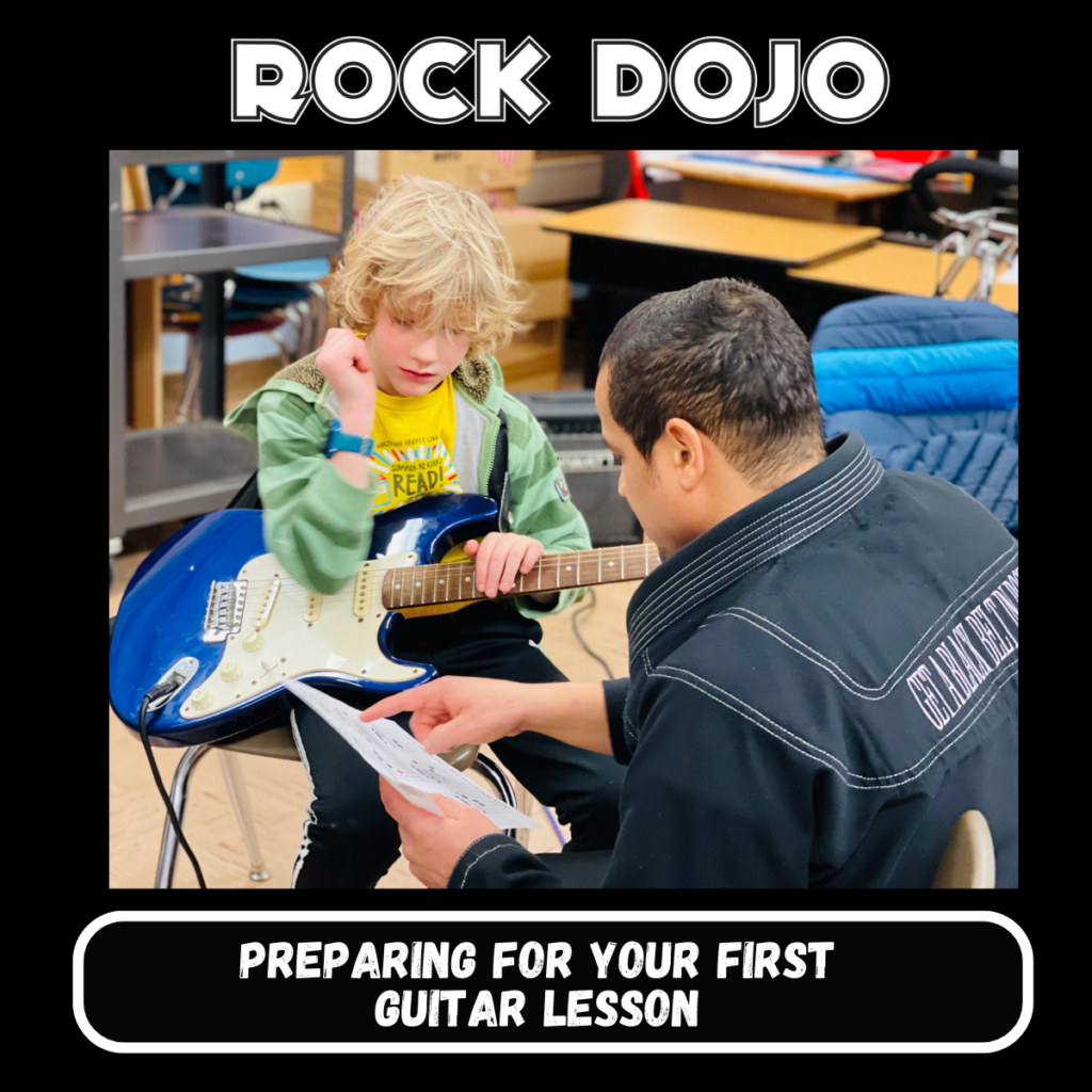 Child taking a guitar lesson at Rock Dojo.