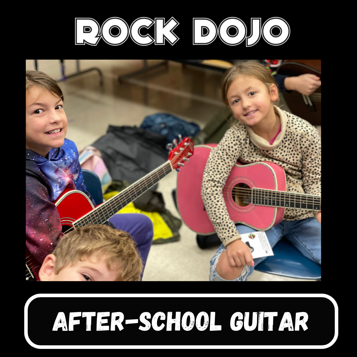 A group of young students enthusiastically participating in an after-school guitar class at Rock Dojo.