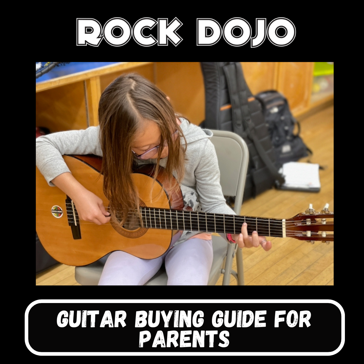 Enthusiastic young student participating in a Rock Dojo after-school guitar class, exemplifying beginner guitar for kids.