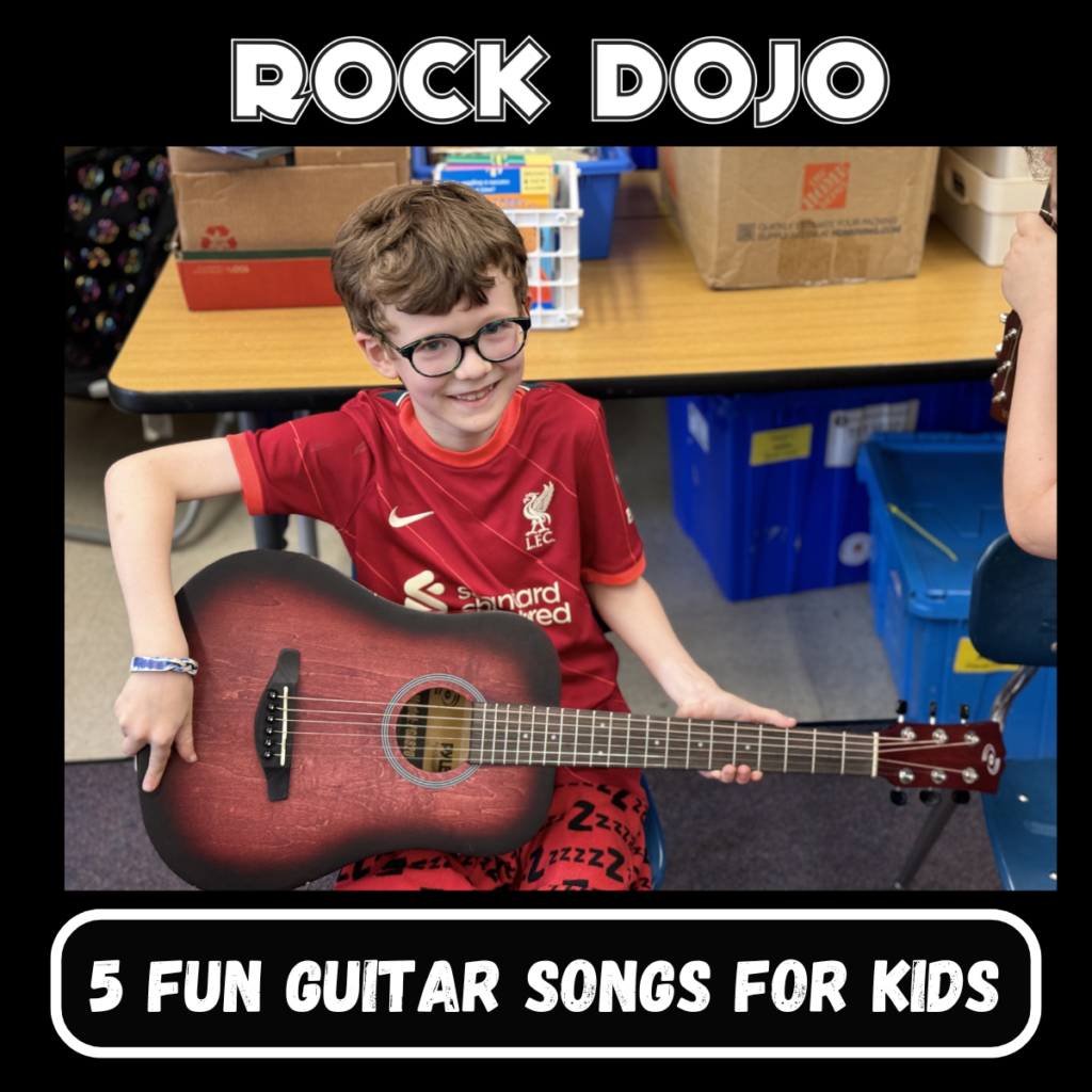 Young boy smiling and holding a guitar, showcasing fun guitar songs for kids at Rock Dojo.